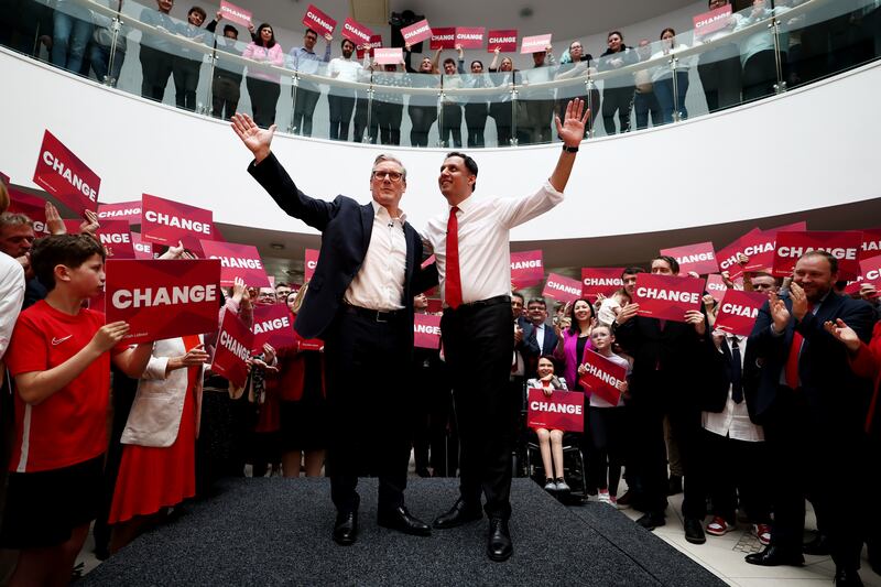 Mr Starmer and his Scottish counterpart, Anas Sarwar, greet supporters at the launch of the Scottish Labour general election campaign at Caledonia House in Glasgow. Getty Images