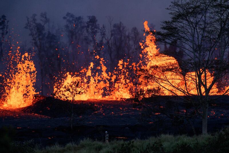 Lava from this fissure eruption isolated a community of 40 homes, and evacuations became mandatory, Pahoa, Hawaii. Bruce Omori / Paradise Helicopters / EPA