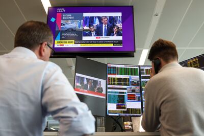 Traders at Peel Hunt watch as UK Chancellor Of The Exchequer Jeremy Hunt presents his Autumn Statement, in November. Bloomberg