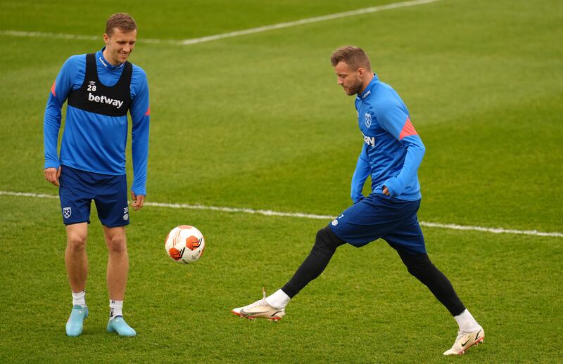 Tomas Soucek, left, and Andriy Yarmolenko during a training session at Rush Green, London. PA