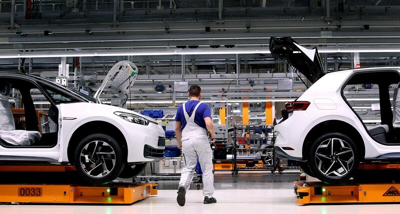 A Volkswagen factory employee works on an electric car assembly line in Germany, which plans to overhaul its flagship industry. AFP