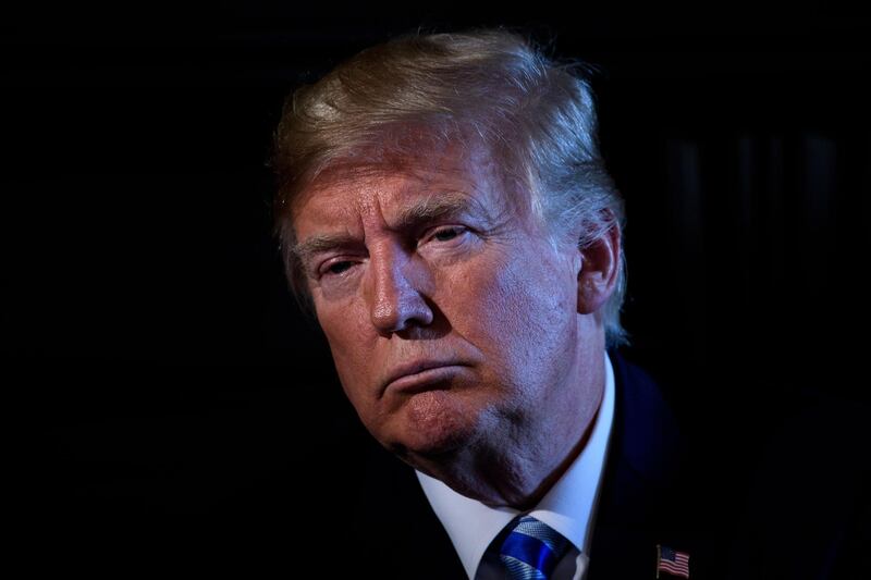 TOPSHOT - US President Donald Trump chairs a meeting with administration and state officials on prison reform at the Trump National Golf Club August 9, 2018 in Bedminster, New Jersey. (Photo by Brendan Smialowski / AFP)