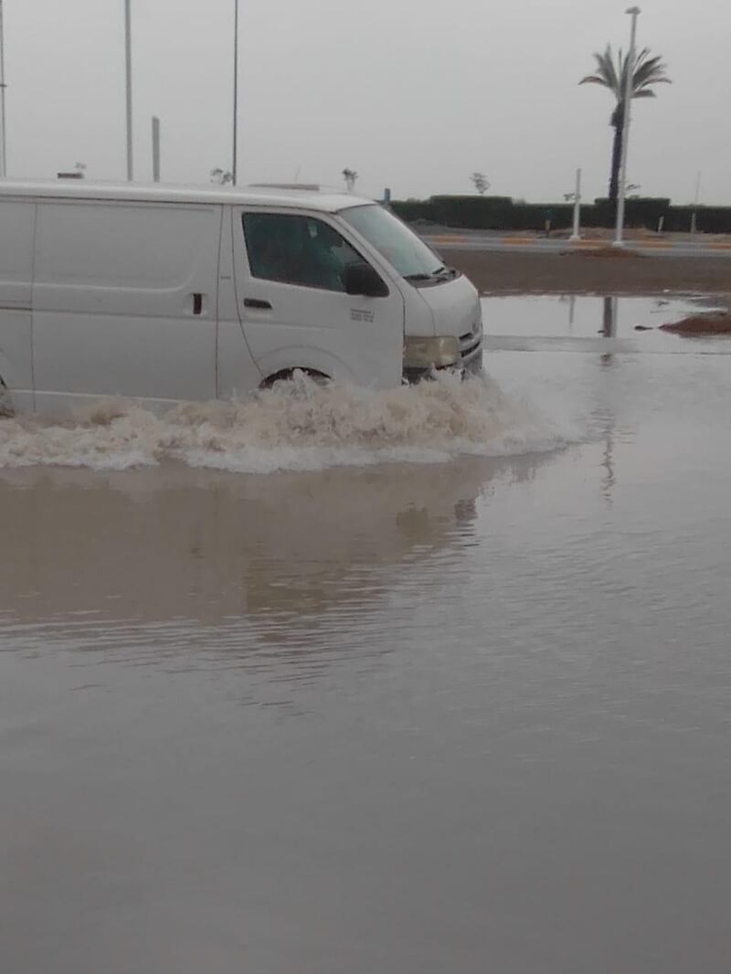 A delivery van struggles to navigate flood waters near Al Bateen airport in Abu Dhabi on Saturday about 9am. Courtesy: Scott Walker