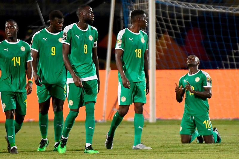 Senegal forward Sadio Mane, right, celebrates after scoring the first of his two second-half goals against Kenya. AFP