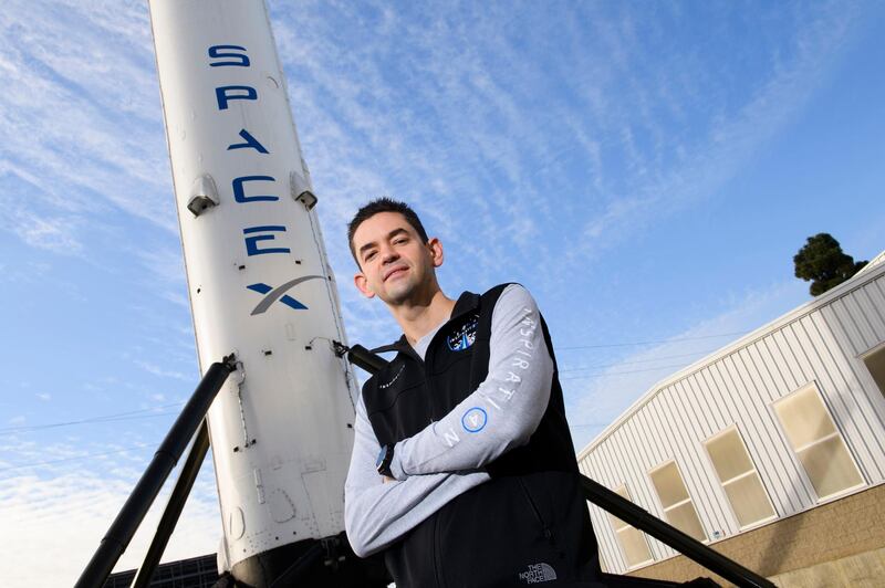 Inspiration4 mission commander Jared Isaacman, founder and chief executive officer of Shift4 Payments, stands for a portrait in front of the recovered first stage of a Falcon 9 rocket at Space Exploration Technologies Corp. (SpaceX) in Hawthorne, California.  AFP