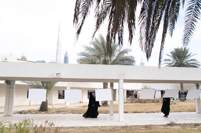 DUBAI, UNITED ARAB EMIRATES, 13 JAN 2017. 
Visitors at a photo exhibition set up by "With Hope" in Al Amal Hospital in Al Wasl, which is going to be demolished to make space for a commercial project.

This exhibition is organized by "With Hope", which consists of a group of 7 girls who are architects, social workers, and artists have been working for over a year with Al Amal Hospital patients, offering art therapy workshops. 

Photo: Reem Mohammed / The National (Reporter: Ramola Talwar  / Section: NA) ID  42879 *** Local Caption ***  RM_20170113_AMAL_013.JPG