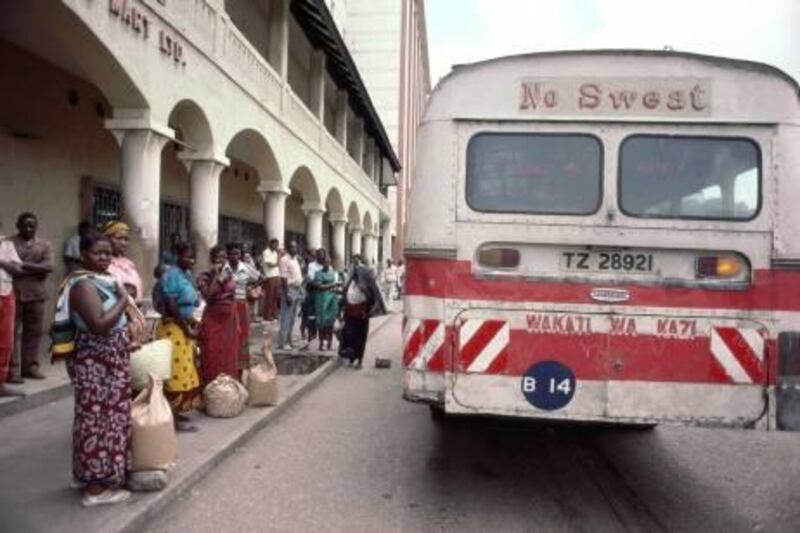 Tanzania, Dar es Salaam city, people waiting for bus in street