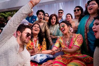 Priyanka Chopra and Nick Jonas celebrate during a mehendi ceremony, a day before their wedding, at Umaid Bhawan in Jodhpur, India. Photo: Raindrop Media via AP