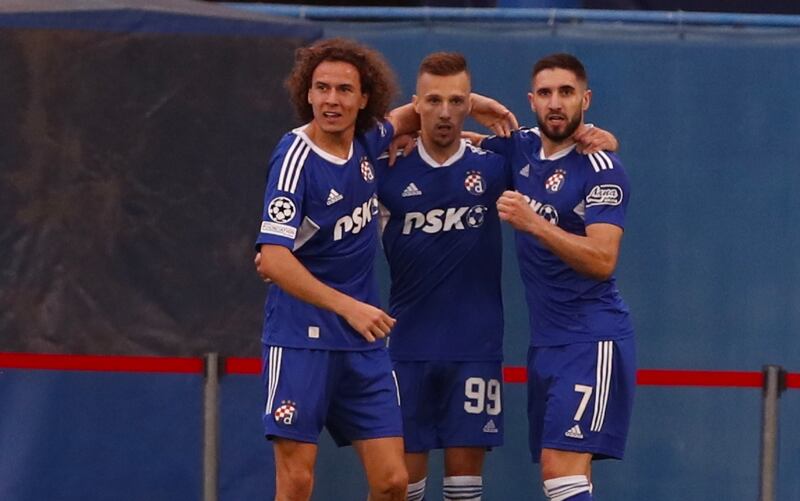 Dinamo Zagreb's Mislav Orsic celebrates with teammates after scoring their first goal. EPA 