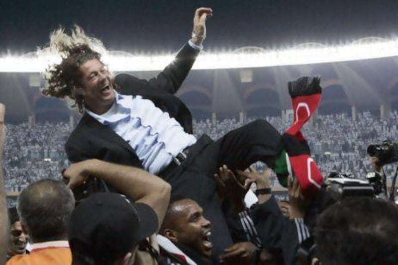Coach Bruno Metsu is held aloft, left, after taking the UAE to Gulf Cup glory on January 30, 2007.