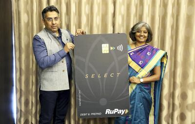 DUBAI ,  UNITED ARAB EMIRATES , SEPTEMBER 19 – 2019 :-  Left to Right - Arif Khan, Chief Digital Officer, NPCI and Praveena Rai, Chief Operating Officer, National Payments Corporation of India (NPCI) showing the RuPay Card during the press conference held at Waldorf Astoria Dubai on Palm Jumeirah in Dubai. ( Pawan Singh / The National ) For Business. Story by Nada