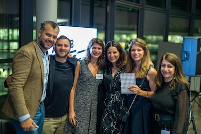 The children’s author and illustrator Nadine Kaadan, second from right, celebrates her award with family and friends. Courtesy Arab British Centre