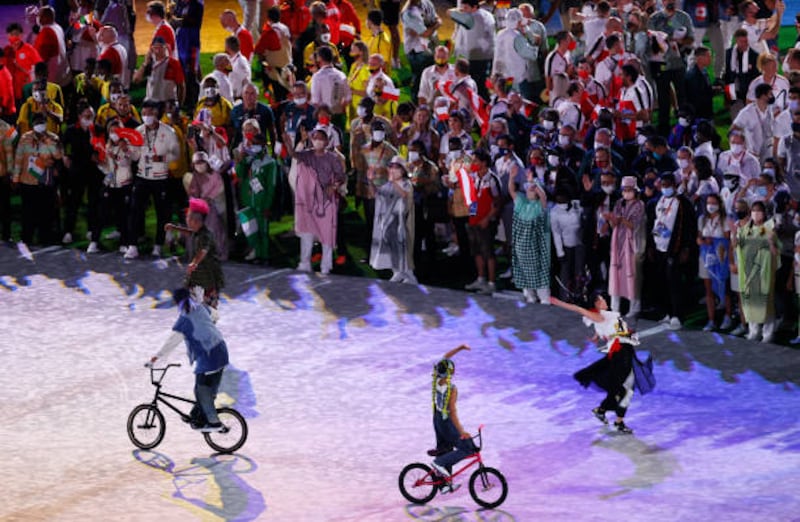 Athletes enjoy the Tokyo Olympics closing ceremony.