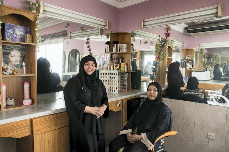 ABU DHABI, UNITED ARAB EMIRATES - AUGUST 16, 2018. 

Nafisa Enayatulla, 56, owner of Abeer Beauty & Henna salon in Baniyas, with her daughter Fatima Moinul Haque, 23.

(Photo by Reem Mohammed/The National)

Reporter: Anna Zacharias
Section:  NA
