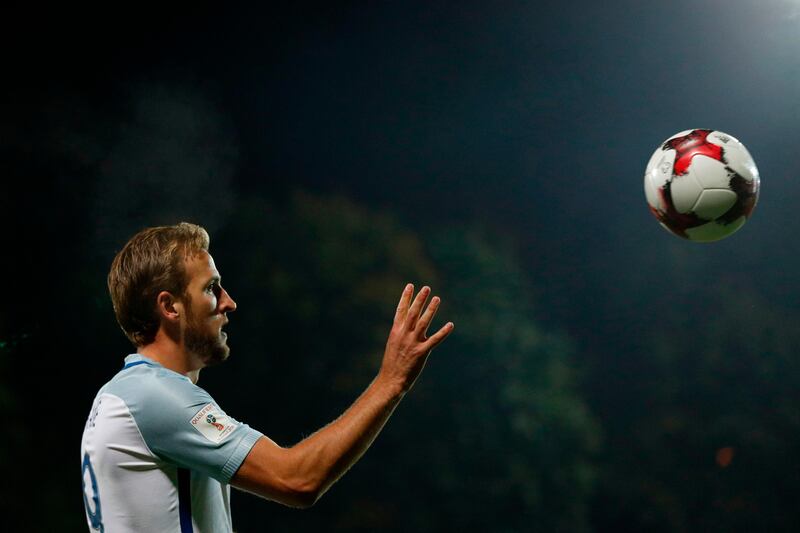 England's striker Harry Kane catches the ball on the touchline during the 2018 FIFA World Cup European Qualifying football match between Lithuania and England at the LFF Stadium in Vilnius on October 8, 2017. / AFP PHOTO / Adrian DENNIS