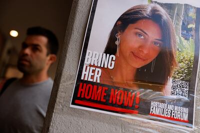 A poster in Tel Aviv with a picture of a hostage kidnapped in the October 7 attack on Israel by Hamas. Reuters