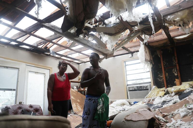 Latasha Myles and Howard Anderson stand in their living room in Lake Charles, Louisiana. AFP