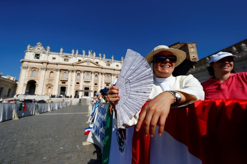 People brave heat to attend the general audience in St Peter's Square, at the Vatican.  Reuters