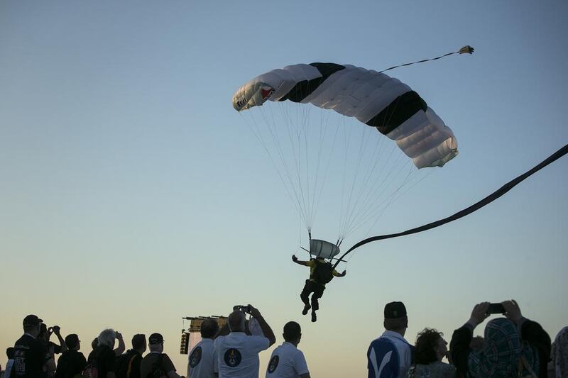 A skydiver flies through the final layer of air over the audience before he lands on the runway at the10th Annual Al Ain Aerobatics Show. Silvia Razgova / The National