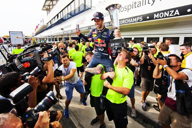 Daniel Ricciardo is held aloft by Red Bull team members after his win in Hungary. Drew Gibson / Getty Images

