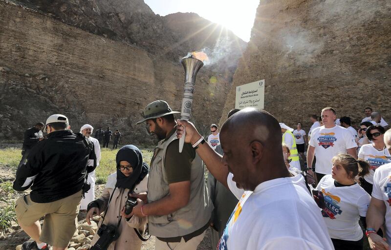 FUJAIRAH , UNITED ARAB EMIRATES , March 4 – 2019 :- Allen Jones from Law Enforcement Torch Run holding the Special Olympics torch “Flame of Hope” in Wadi Al Wurayah Waterfalls in Fujairah. ( Pawan Singh / The National )
For News/Online/Instagram/Big Picture. Story by Ruba
