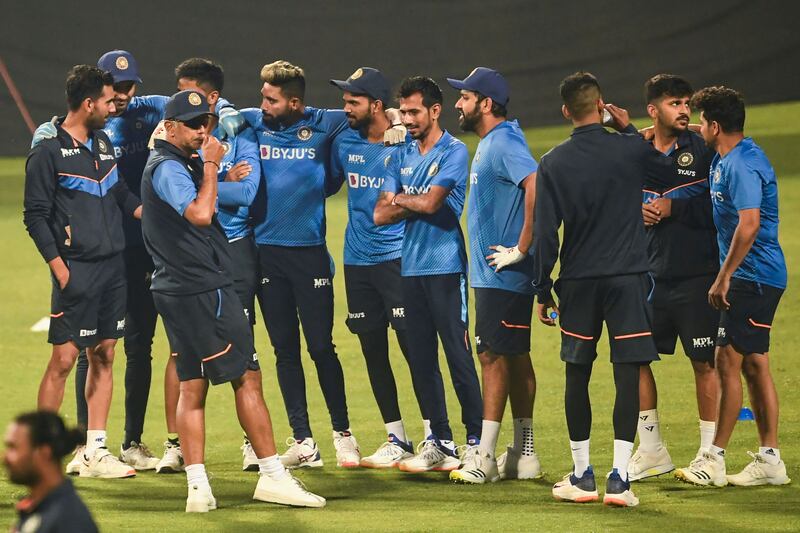 India captain Rohit Sharma, fourth right, and coach Rahul Dravid, third left, during training in Kolkata. AFP