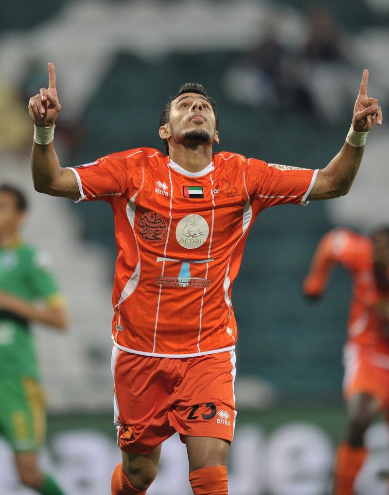 Ajman's Waleed Ahmed Hassan celebrates following a score during the Semi-Final Pro League football match between Al Shabab (green) v Ajman (orange) at Shabab's Maktoum Bin Rashid Al Maktoum Stadium on 25.03.2013. Ashraf Umrah / Al Ittihad


 


 