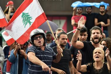 Lebanese protesters react following a speech by the Lebanese President Michel Aoun during a demonstration on the eighth day of protest in Jal El Dib north of Beirut. EPA