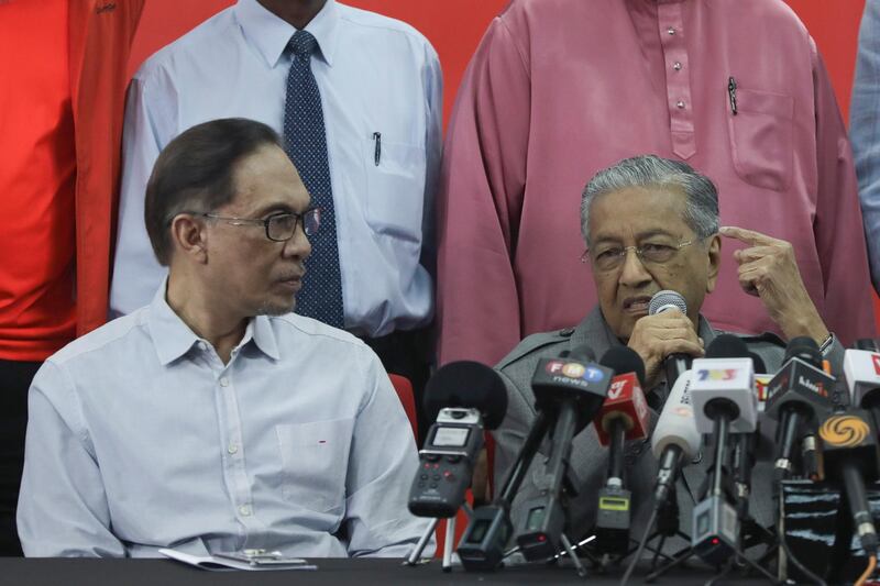 epa08242696 (FILE) - Malaysia New Prime Minister Mahathir Mohamad (R) speaks as Malaysia politician Anwar Ibrahim (L) looks on during a press conference in Kuala Lumpur, Malaysia, 01 June 2018 (reissued 24 February 2020). According to media reports, Mahathir Mohamad has resigned as Malaysian prime minister.  EPA/FAZRY ISMAIL