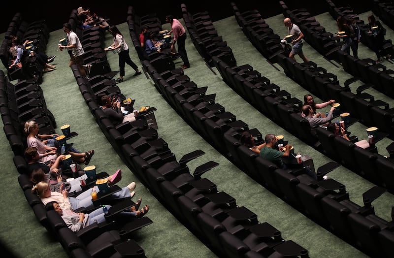 Filmgoers get comfortable for their movie at Roxy Xtreme in Dubai. It will be shown on a screen measuring 423 square metres, or 28 metres by 15. 1 metres. That’s about twice the size of a tennis court.