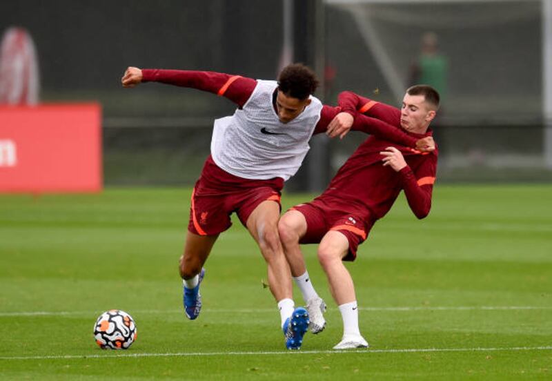 Ben Woodburn and Rhys Williams during Liverpool's training session.