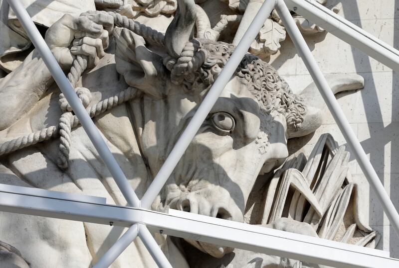 A sculpture of the Arc de Triomphe is protected during preparations for 'L'Arc de Triomphe, Wrapped'. AP