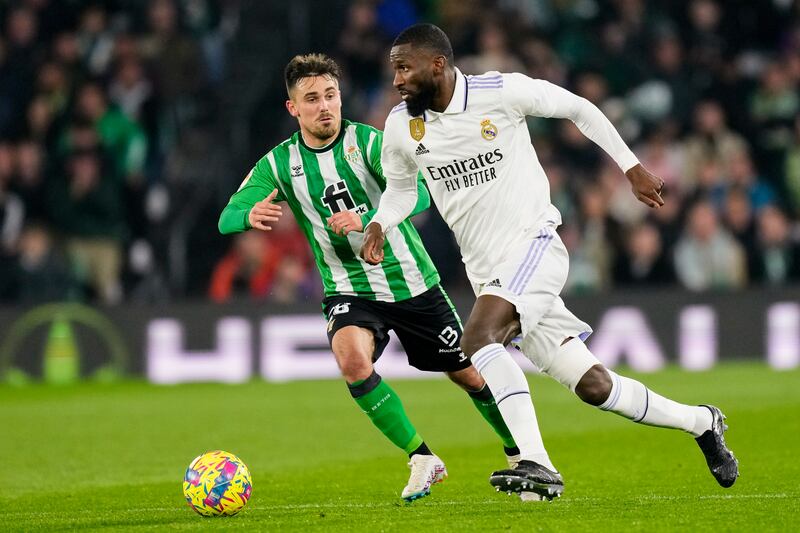 Real Madrid's Antonio Rudiger, front, and Betis' Rodri compete for the ball. AP Photo