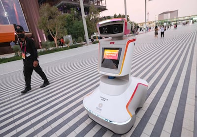 A robot displays Covid-19 protection instructions at Expo 2020 Dubai. AFP