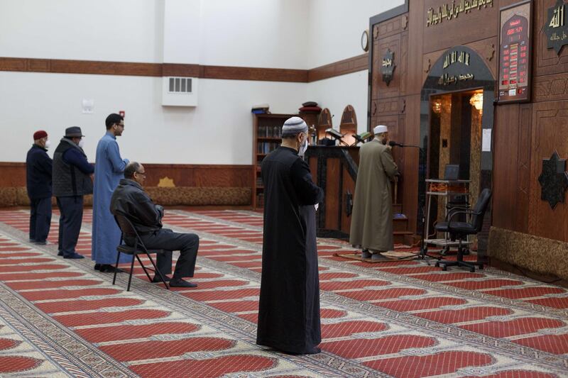 Imam Magdy Badr leads prayers over a live broadcast on a laptop in a nearly empty room at Masjid Al Salaam mosque on the first full day of Ramada on April 24, 2020 in Dearborn, Michigan. Getty Images via AFP