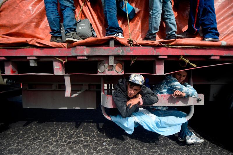Central American migrants moving towards the US ride onboard a truck from La Piedad to Vista Hermosa, Michoacan state, Mexico. AFP