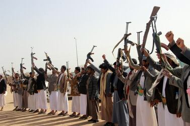 Gunmen wave their weapons during a pro-Houthi rally in Saada in northern Yemen . AFP