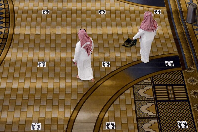 Saudi Muslims worshippers arrive for noon prayer at Al Rajhi mosque in the capital Riyadh. AFP