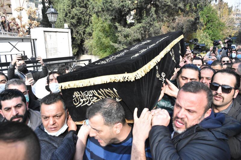 Mourners carry Hatem Ali's coffin. EPA