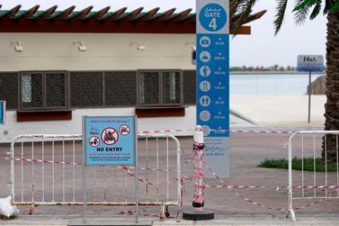 No entry signs at Corniche Beach in Abu Dhabi in April. Public beaches and parks were closed in March to prevent the spread of Covid-19. Victor Besa / The National 