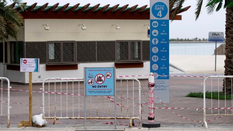 No entry signs at Corniche Beach in Abu Dhabi in April. Public beaches and parks were closed in March to prevent the spread of Covid-19. Victor Besa / The National 