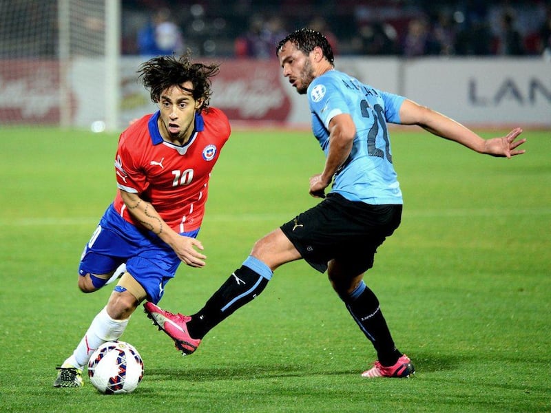 Jorge Valdivia, left, in Copa America action against Uruguay. He will complete his move to Al Wahda when Chile's involvement in the tournament ends. Martin Bernetti / AFP / June 24, 2015