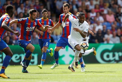 Football Soccer - Premier League - Crystal Palace vs Swansea City - London, Britain - August 26, 2017   Swansea City's Jordan Ayew in action with Crystal Palace's Scott Dann and Luka Milivojevic    REUTERS/Peter Nicholls    EDITORIAL USE ONLY. No use with unauthorized audio, video, data, fixture lists, club/league logos or "live" services. Online in-match use limited to 45 images, no video emulation. No use in betting, games or single club/league/player publications. Please contact your account representative for further details.