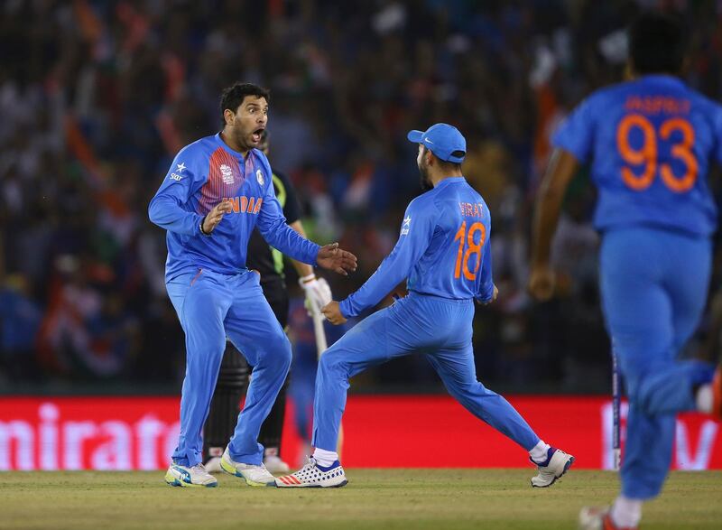 MOHALI, INDIA - MARCH 27:  Yuvraj Singh of India celebrates after taking the wicket of Steve Smith of Australia during the ICC WT20 India Group 2 match between India and Australia at I.S. Bindra Stadium on March 27, 2016 in Mohali, India.  (Photo by Ryan Pierse/Getty Images)