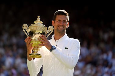 Novak Djokovic celebrates with the Trophy following his victory over Nick Kyrgios in The Final of the Gentlemen's Singles on day fourteen of the 2022 Wimbledon Championships at the All England Lawn Tennis and Croquet Club, Wimbledon. Picture date: Sunday July 10, 2022.