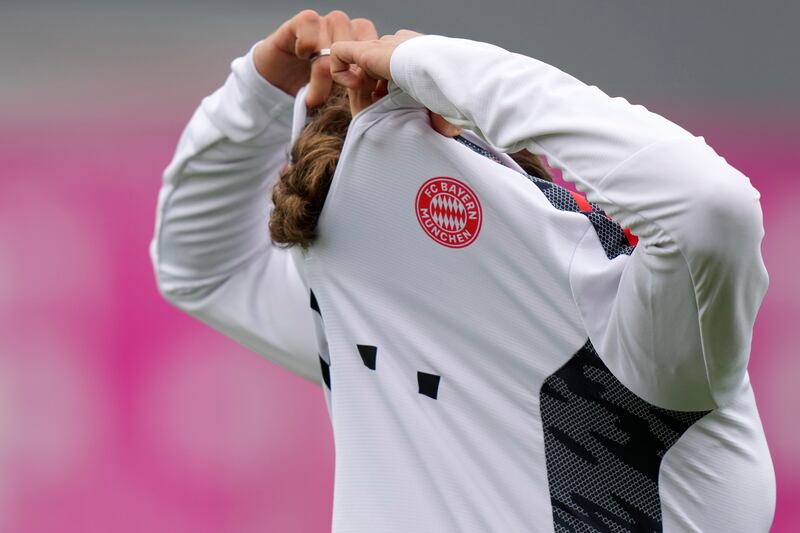 Bayern's Thomas Muller takes off his shirt. AP