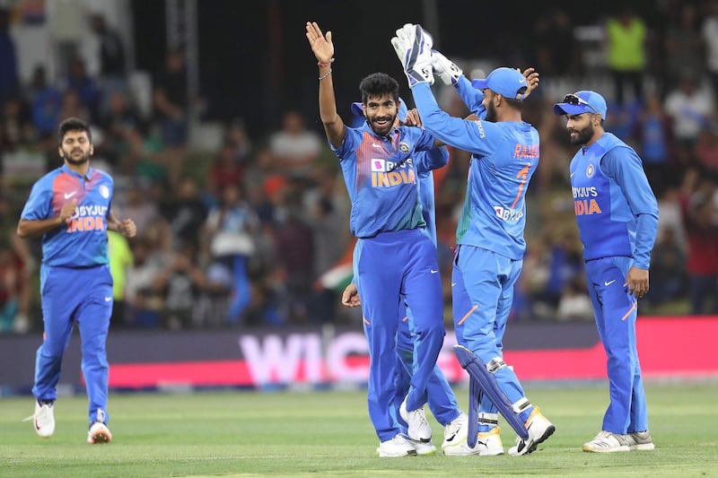 India’s Jasprit Bumrah, centre, celebrates after taking the wicket of New Zealand’s Daryl Mitchell during the fifth T20 at the Bay Oval in Mount Maunganui on Sunday. AFP