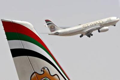 Abu Dhabi - 12th October ,  2008 -Stock Picture of a Etihad Plane taking off from  Abu Dhabi Airport   ( Andrew Parsons  /  The National ) *** Local Caption ***  ap0013-1210-etihad plane stock.jpgap0013-1210-etihad plane stock.jpgna27no-Pg2.jpg