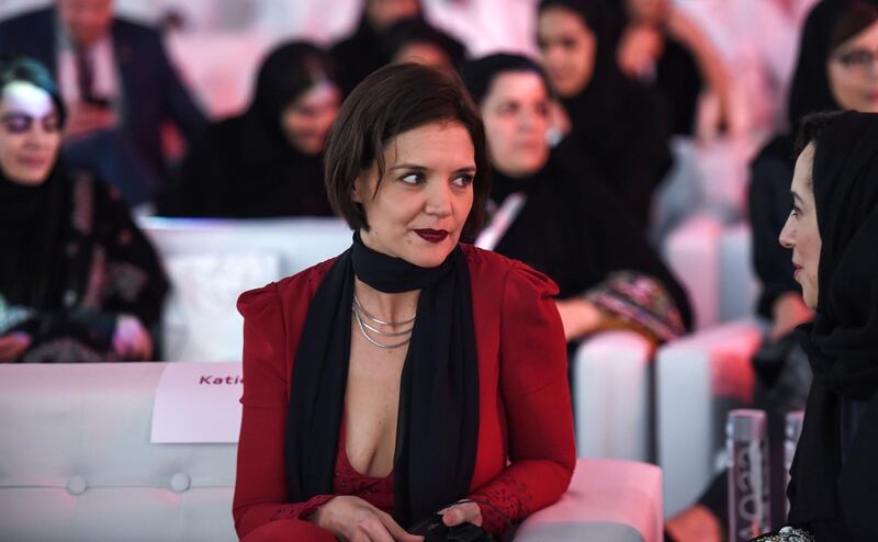 Actress Katie Holmes speaks to a Saudi woman at the Quality of Life Programme. Fayez Nureldine / AFP