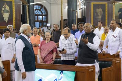 Indian Prime Minister Narendra Modi talking to Congress party president Mallikarjun Kharge, right, with senior leaders Sonia Gandhi and Adhir Ranjan Chowdhury in the old parliament. AP